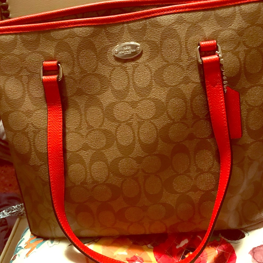 Large Orange and tan Coach tote